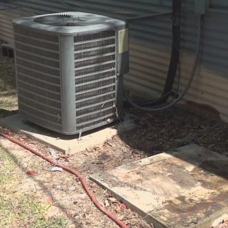 Air conditioner next to a home