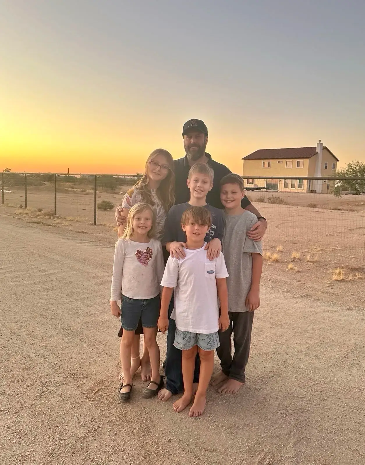 Rickert family in front of a home