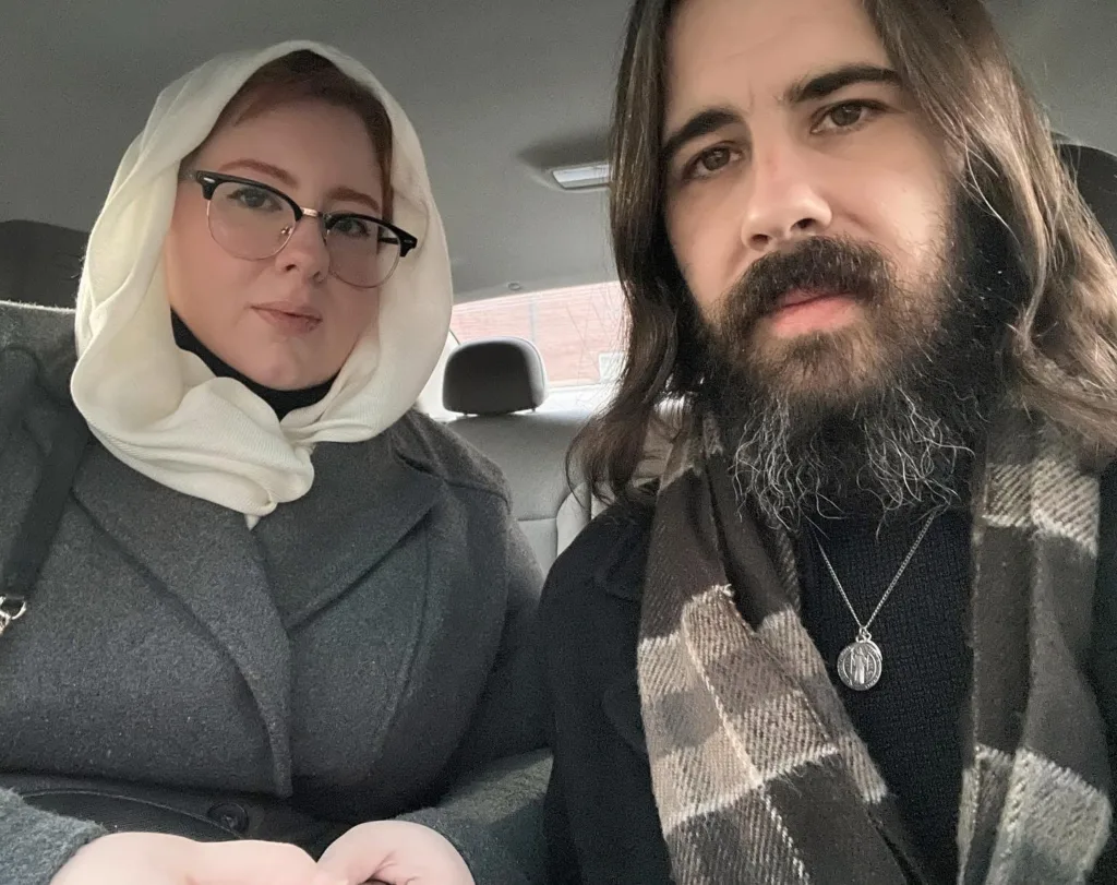 Dymphna and Maxim in a car