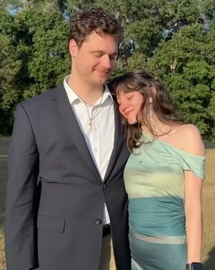 David and Olivia leaning on each other