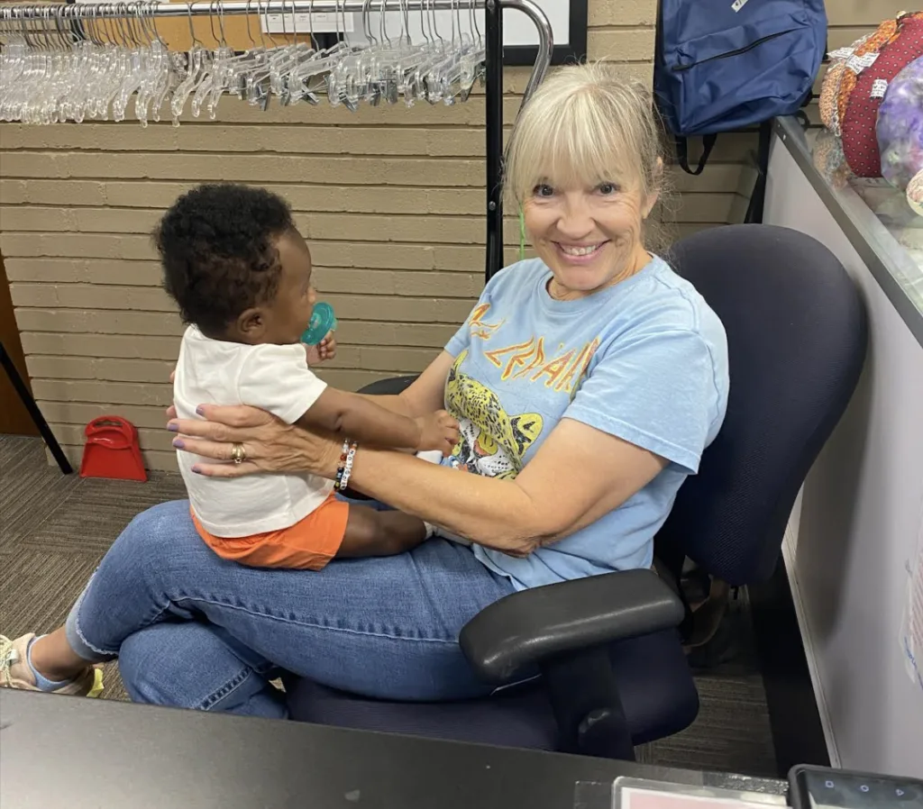 Smiling woman holding a young child
