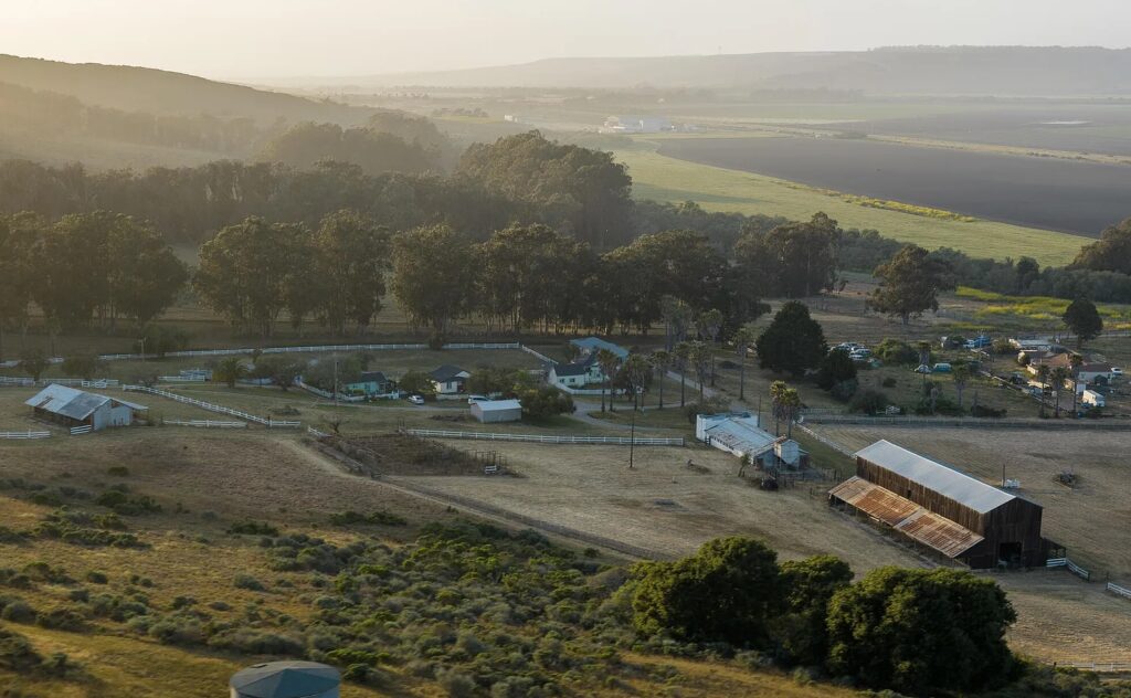 Aerial view of. the countryside including barns and houses